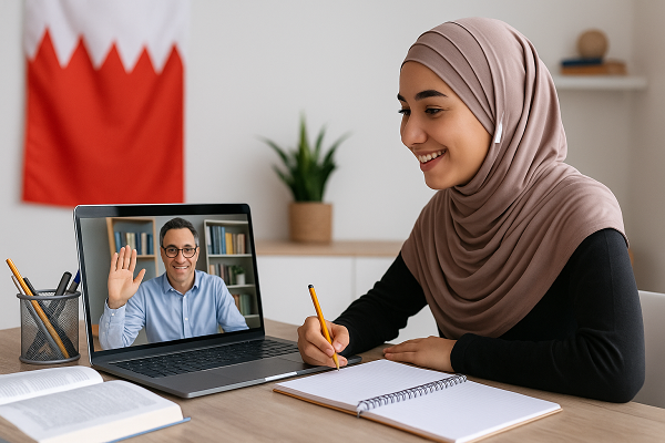 Bahrain student learning online with tutor on laptop